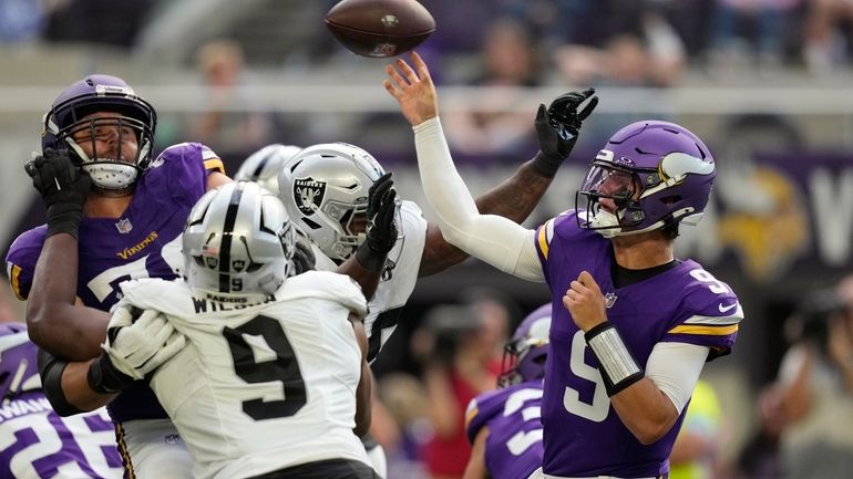 Minnesota Vikings quarterback J.J. McCarthy (9) throws against the Las...