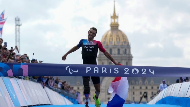 France's Alexis Hanquinquant wins the men's PTS4 Triathlon at the...