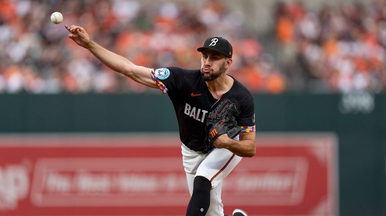 Baltimore Orioles starting pitcher Grayson Rodriguez delivers during the first...