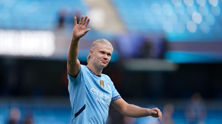 Manchester City's Erling Haaland waves fans after the English Premier...