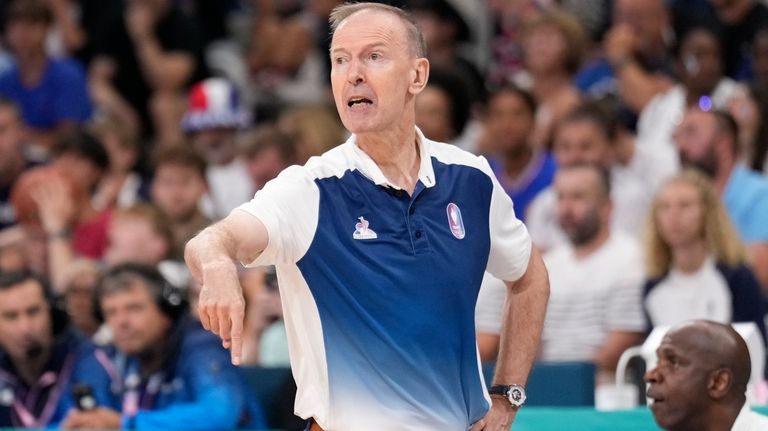 France head coach Vincent Collet gestures in a men's basketball...