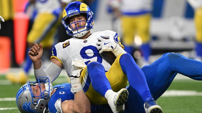 Detroit Lions defensive end Aidan Hutchinson (97) sacks Los Angeles...