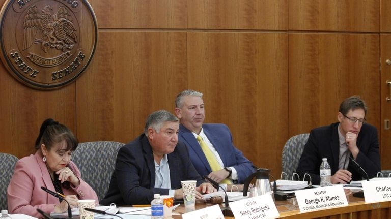 Legislators including Democratic New Mexico Sen. George Muñoz of Gallup,...