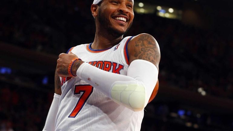 Carmelo Anthony of the Knicks smiles after a basket against...