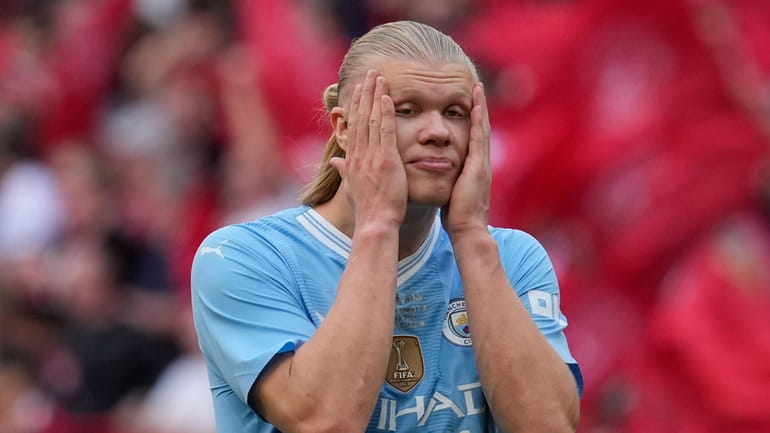 Manchester City's Erling Haaland reacts at the end of the...