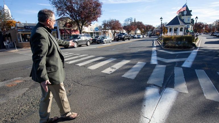 Amityville Mayor Dennis Siry takes a stroll in November in the...