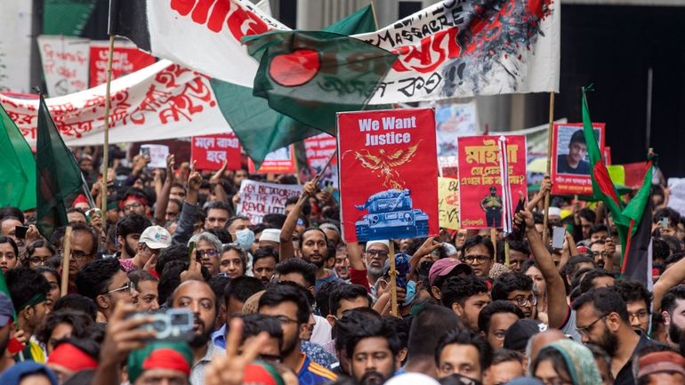 Activists take part in a protest march against Prime Minister...