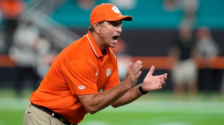 Clemson head coach Dabo Swinney walks on the field before...