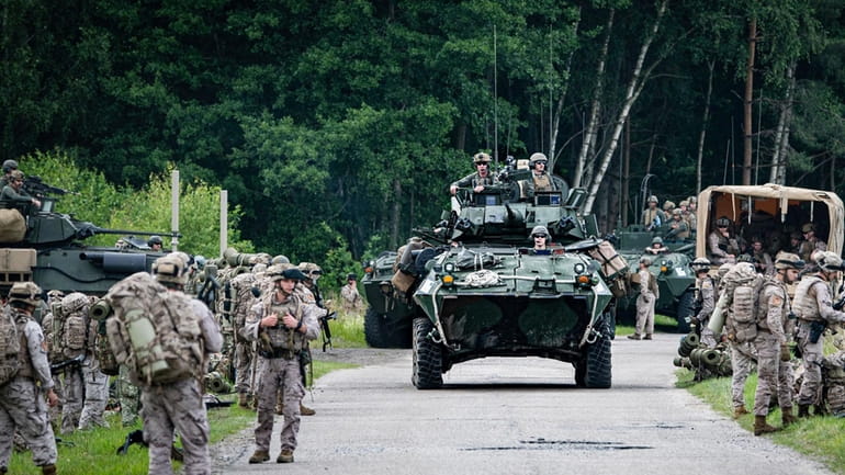 Military armored vehicles take part in the Baltops 2024 exercise...