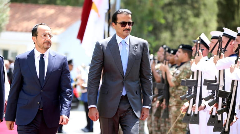 Cyprus' President Nikos Christodoulides, left, and Qatar's Emir Sheikh Tamim...