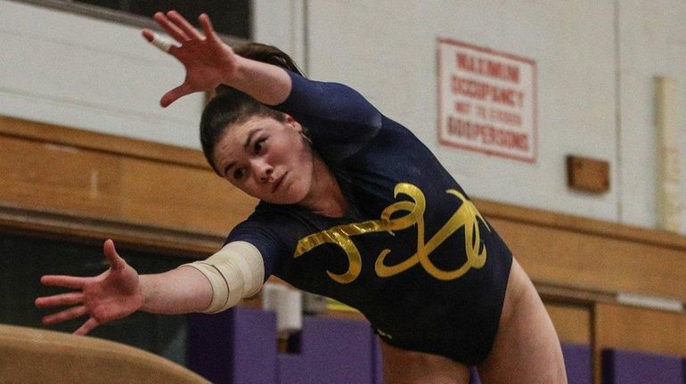 Gillian Murphy of Massapequa performs her vault during a Nassau...