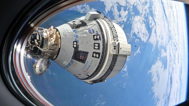 This photo provided by NASA shows Boeing's Starliner spacecraft which...