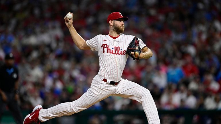 Philadelphia Phillies' Zack Wheeler throws during the third inning of...