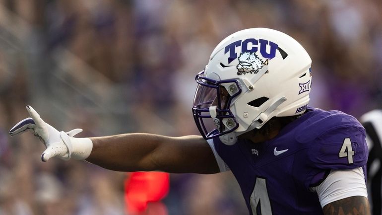 TCU running back Cam Cook (4) celebrates after scoring a...