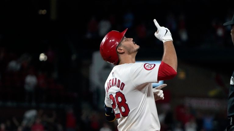 St. Louis Cardinals' Nolan Arenado celebrates after hitting a walk-off...