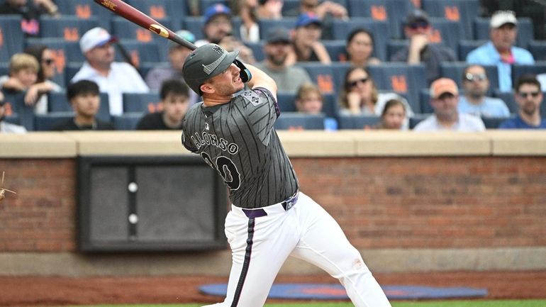 New York Mets first baseman Pete Alonso hits a solo...