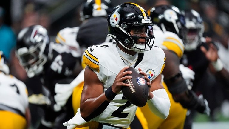 Pittsburgh Steelers quarterback Justin Fields looks to pass during the...