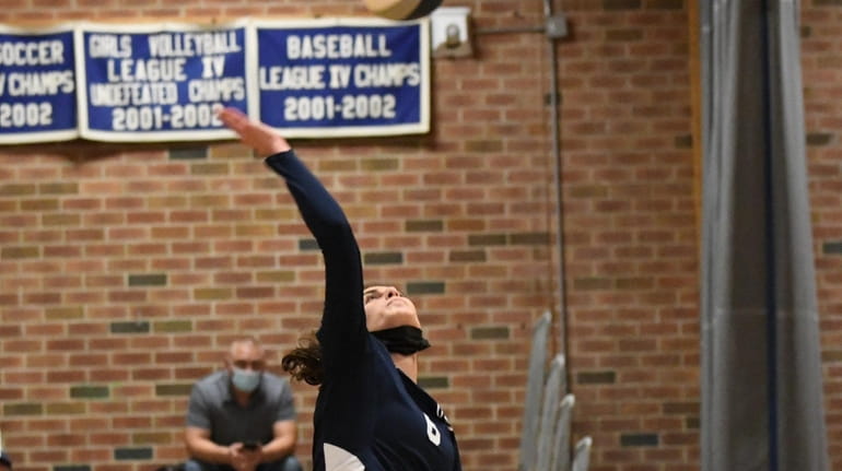 Kasey Tietjen of Smithtown West gets some air for her...