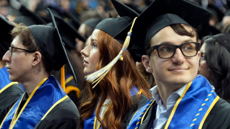 UCLA graduates sit in attendance at their commencement ceremony at...