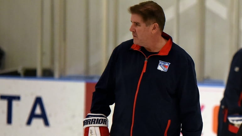 Rangers head coach Peter Laviolette on the practice ice at...