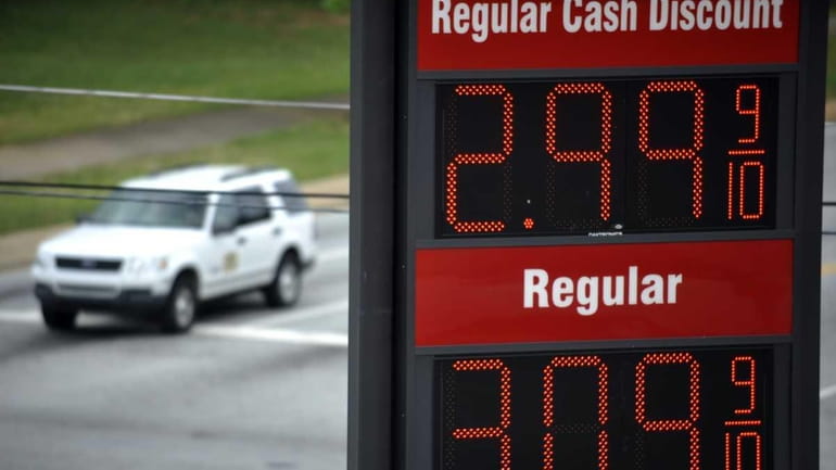 A sign for $2.99 a gallon gasoline is seen as...
