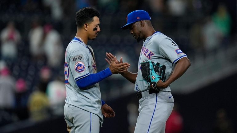 Mets relief pitcher Huascar Brazoban, right, celebrates with third baseman...