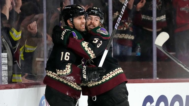 Arizona Coyotes left wing Jason Zucker (16) celebrates after his...