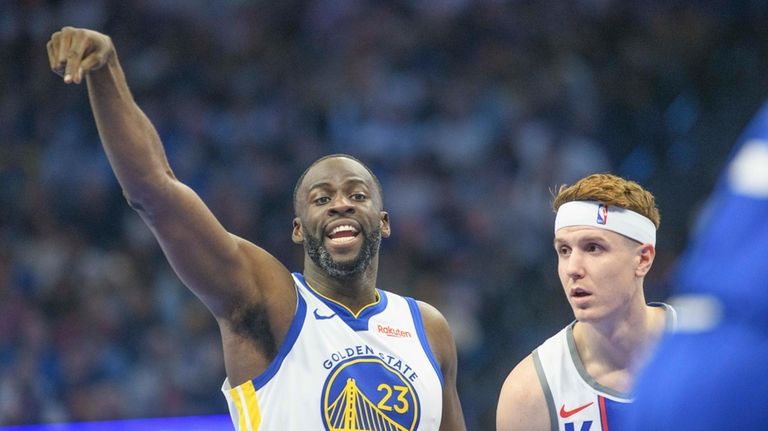 Golden State Warriors forward Draymond Green (23) shouts to teammates...