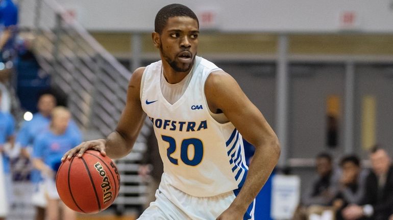 Hofstra guard Jalen Ray advances the ball during the second half of...