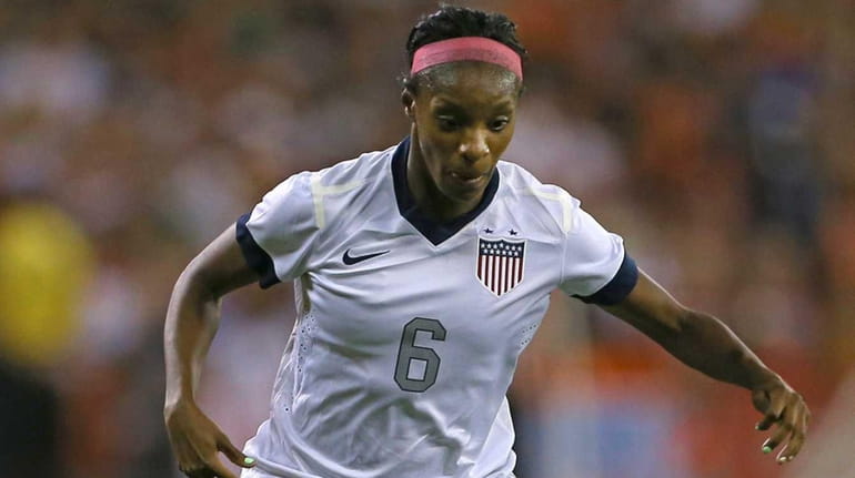 Defender Crystal Dunn of USA brings the ball upfield against...