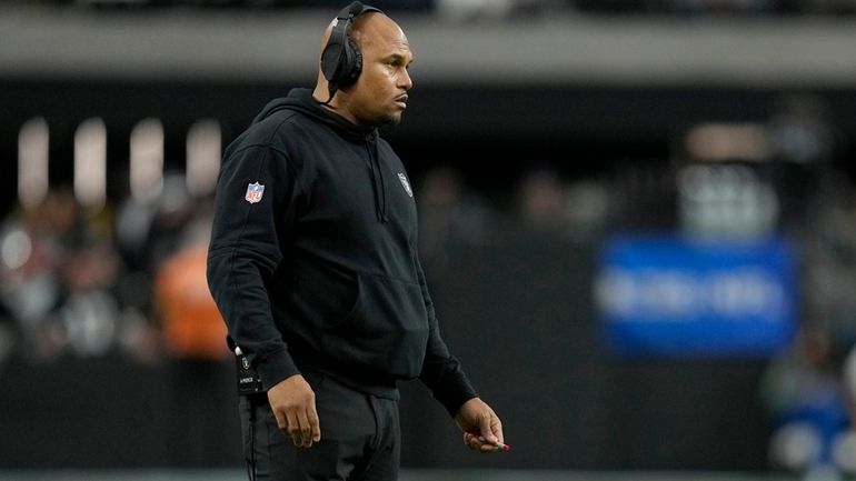 Las Vegas Raiders interim head coach Antonio Pierce stands on...