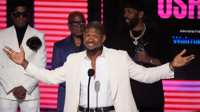 Usher accepts the Lifetime Achievement award during the BET Awards...