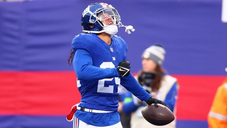 Dane Belton of the Giants celebrates after intercepting a pass in the...