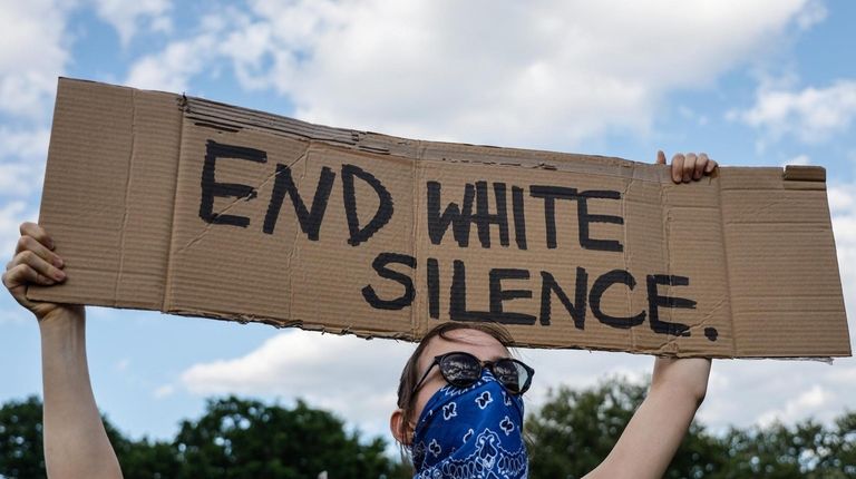 A woman uses a homemade sign to get her message out...