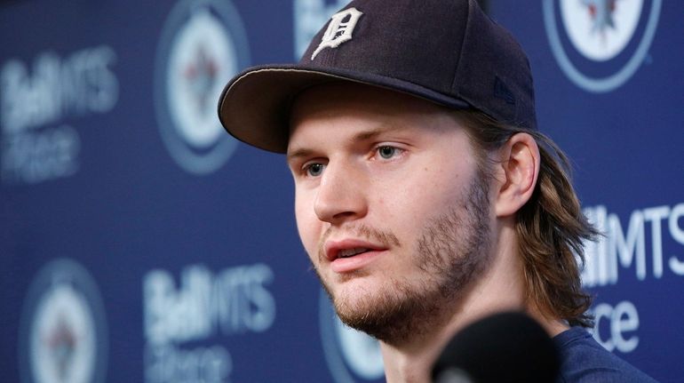 Winnipeg's Jacob Trouba speaks to the media at their closing...