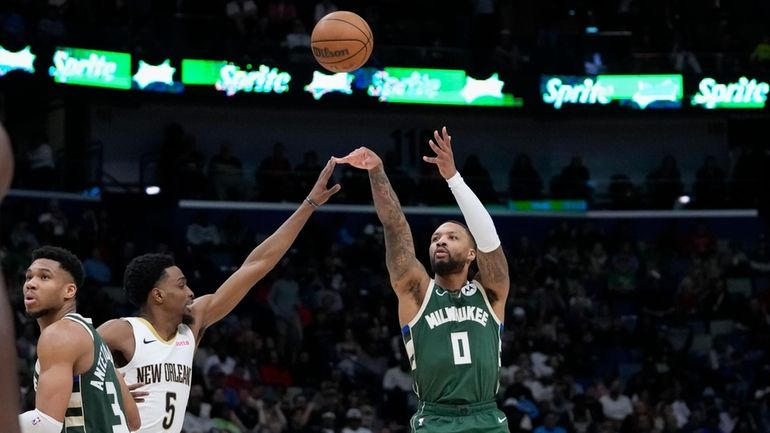 Milwaukee Bucks guard Damian Lillard (0) shoots against New Orleans...