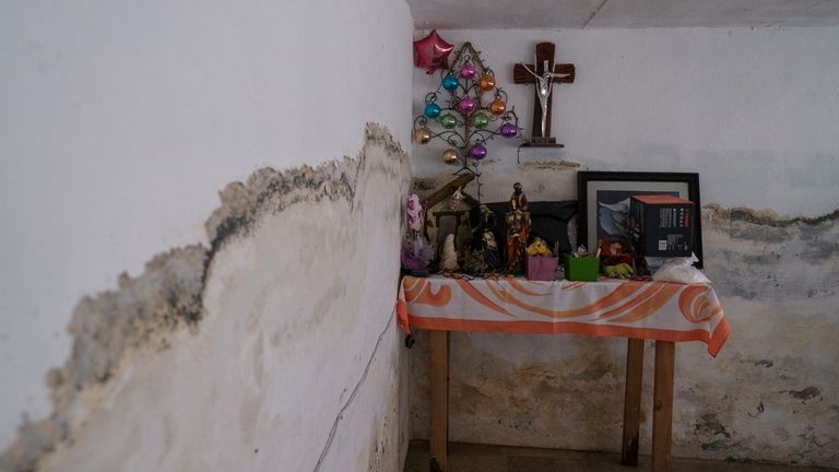 An altar stands in the home of Juana Salazar Segundo...