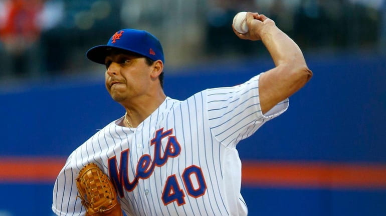 Jason Vargas of the Mets pitches in the first inning...