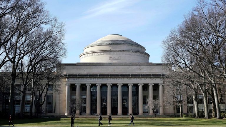 Students walk past the "Great Dome" atop Building 10 on...