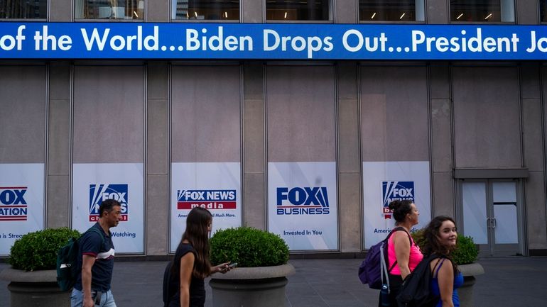 A news crawl appears on the side of the Fox...