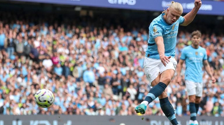 Manchester City's Erling Haaland kicks the ball during the English...