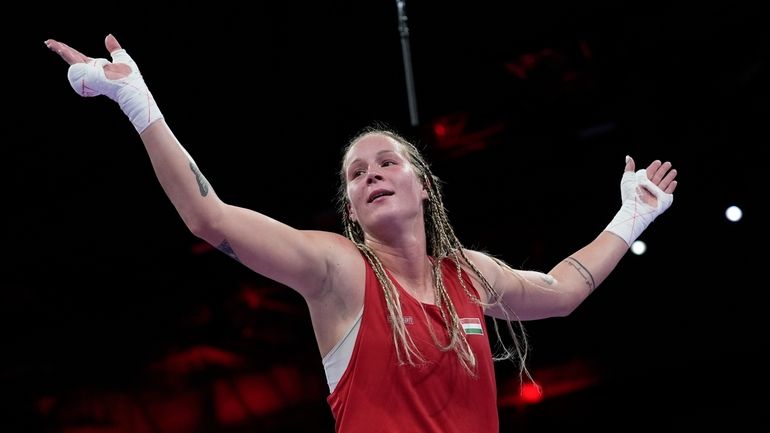 Hungary's Anna Hamori, celebrates after defeated Australia's Marissa Williamson in...