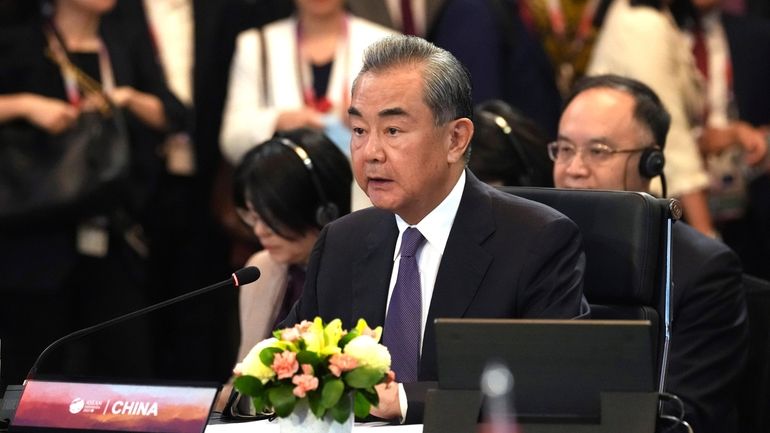 Chinese Communist Party's foreign policy chief Wang Yi speaks during...