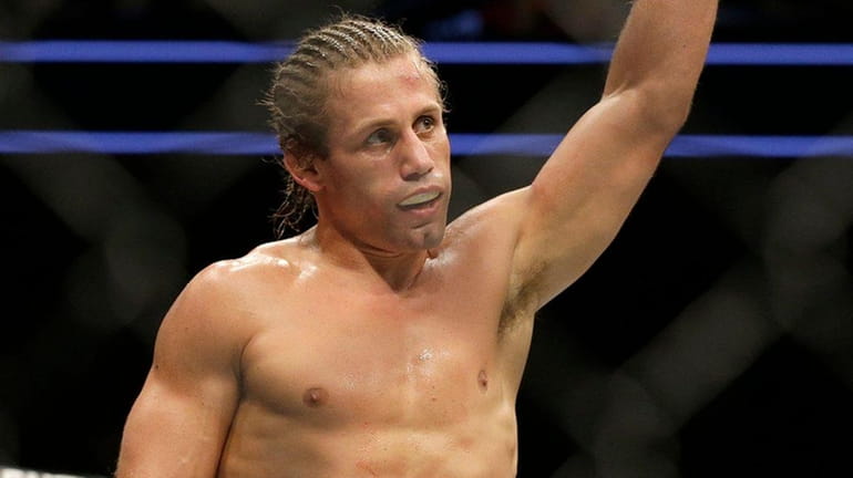 Urijah Faber waves after beating Brad Pickett by unanimous decision...