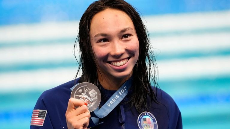 Torri Huske, of the United States, poses with her silver...