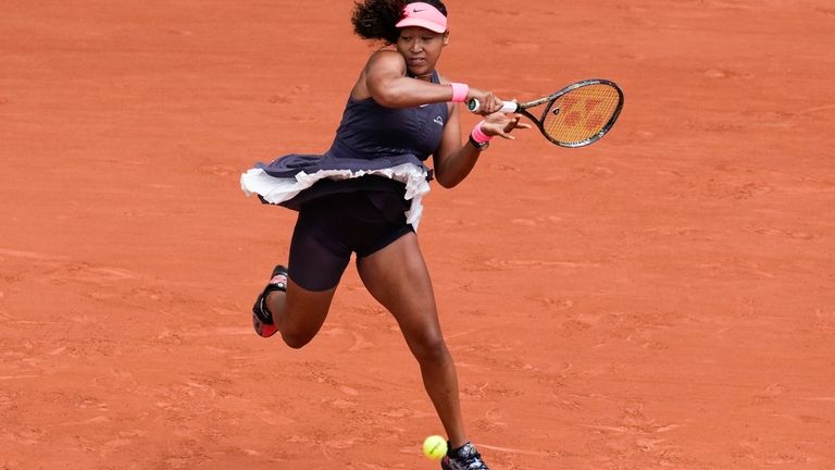 Japan's Naomi Osaka plays a shot against Italy's Lucia Bronzetti...