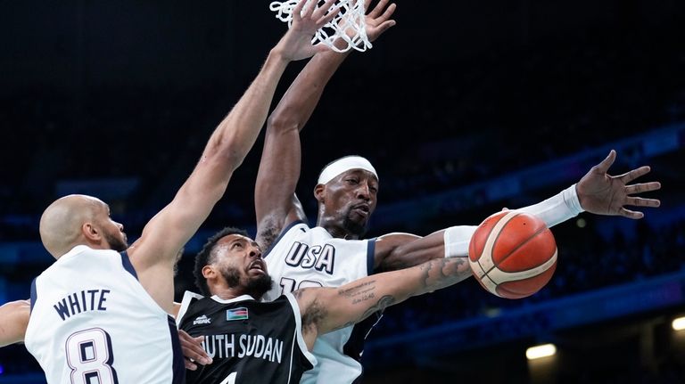 Carlik Jones, of South Sudan, shoots between Derrick White, (8)...