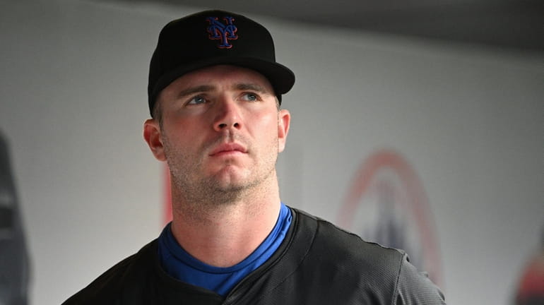 Mets first baseman Pete Alonso looks on from the dugout...