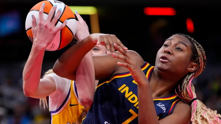 Indiana Fever forward Aliyah Boston (7) is fouled by Los...