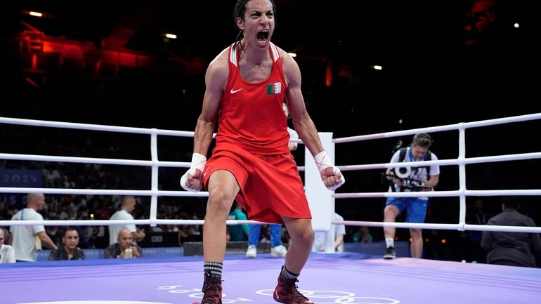 Algeria's Imane Khelif, celebrates after defeating Hungary's Anna Hamori in...